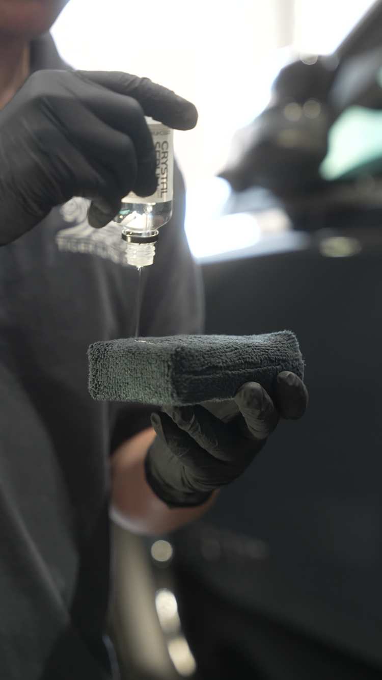 Tiger Auto Spa applying ceramic coating in the shop