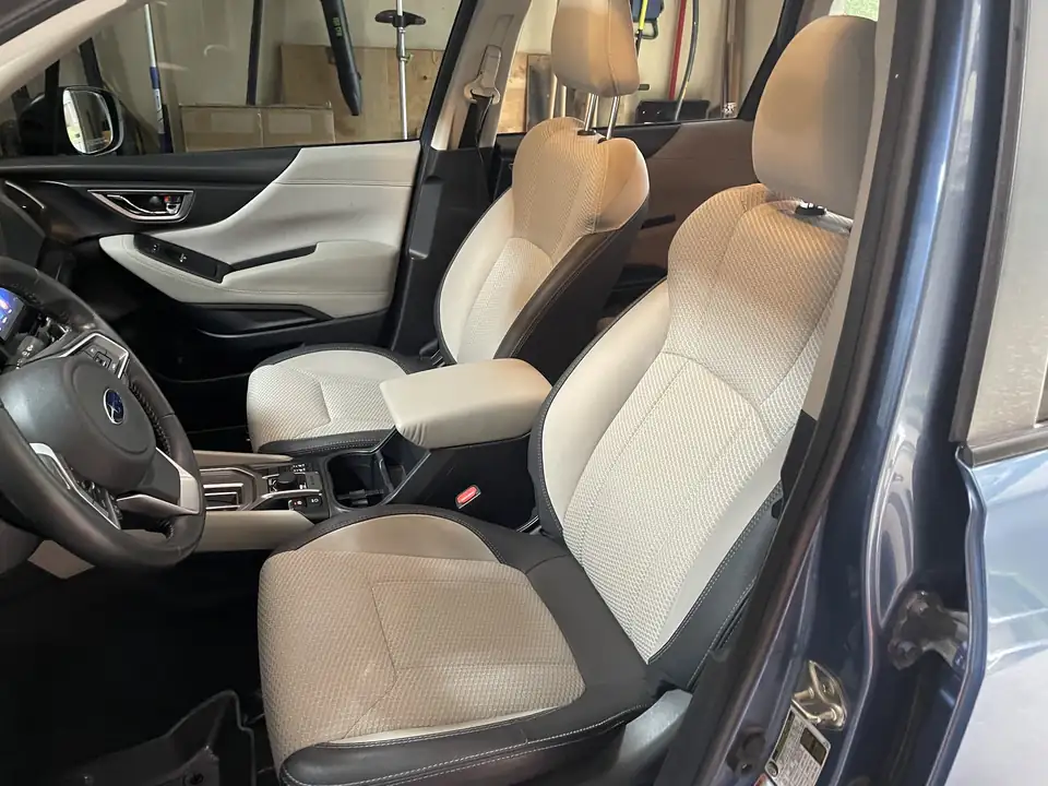 Clean light-colored front seats in a Subaru