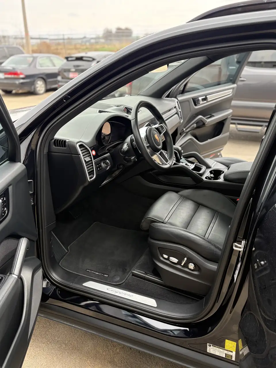 Clean SUV front cabin with the driver door open